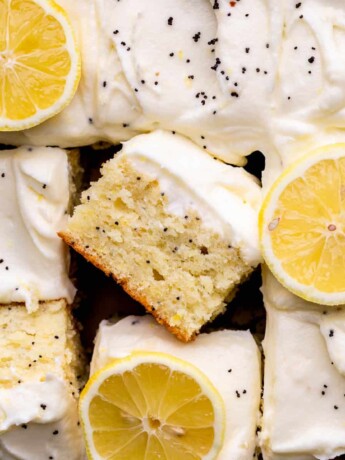 Lemon poppy seed cake with the cake slices on its side.