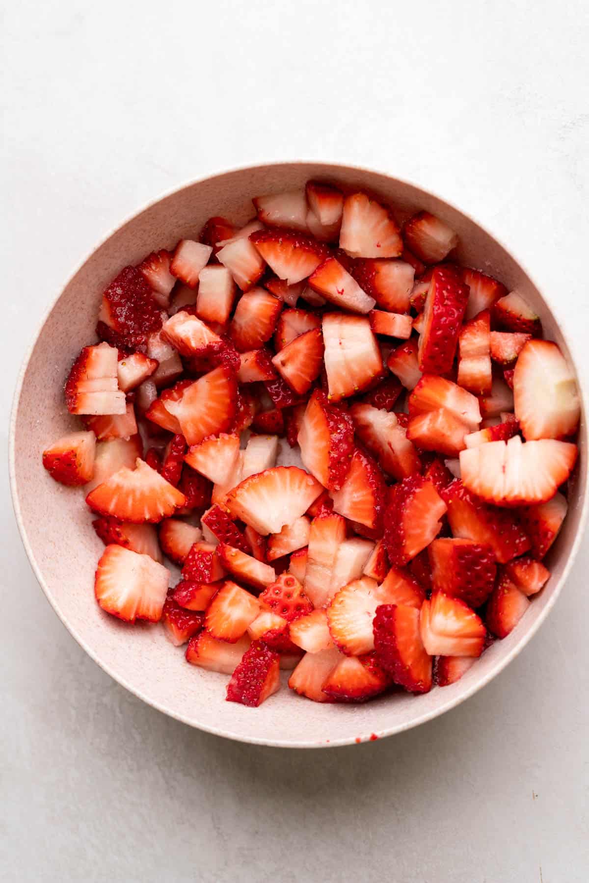 Diced strawberries in a bowl.