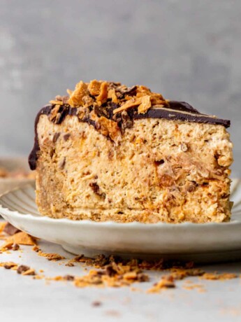 One slice of butterfinger pie on a plate.