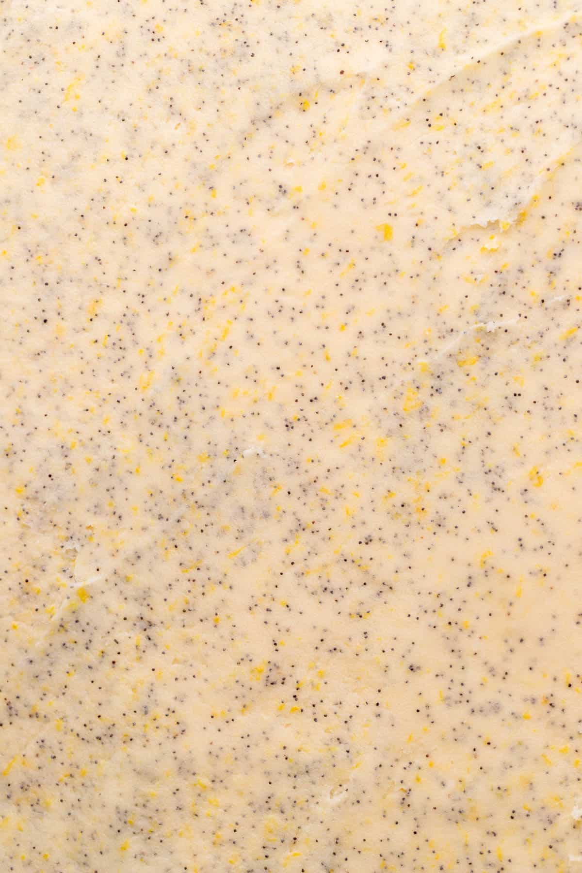 Lemon poppy filling over the dough.
