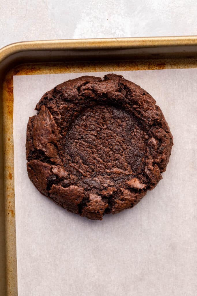Pressed down cookie on cookie sheet.