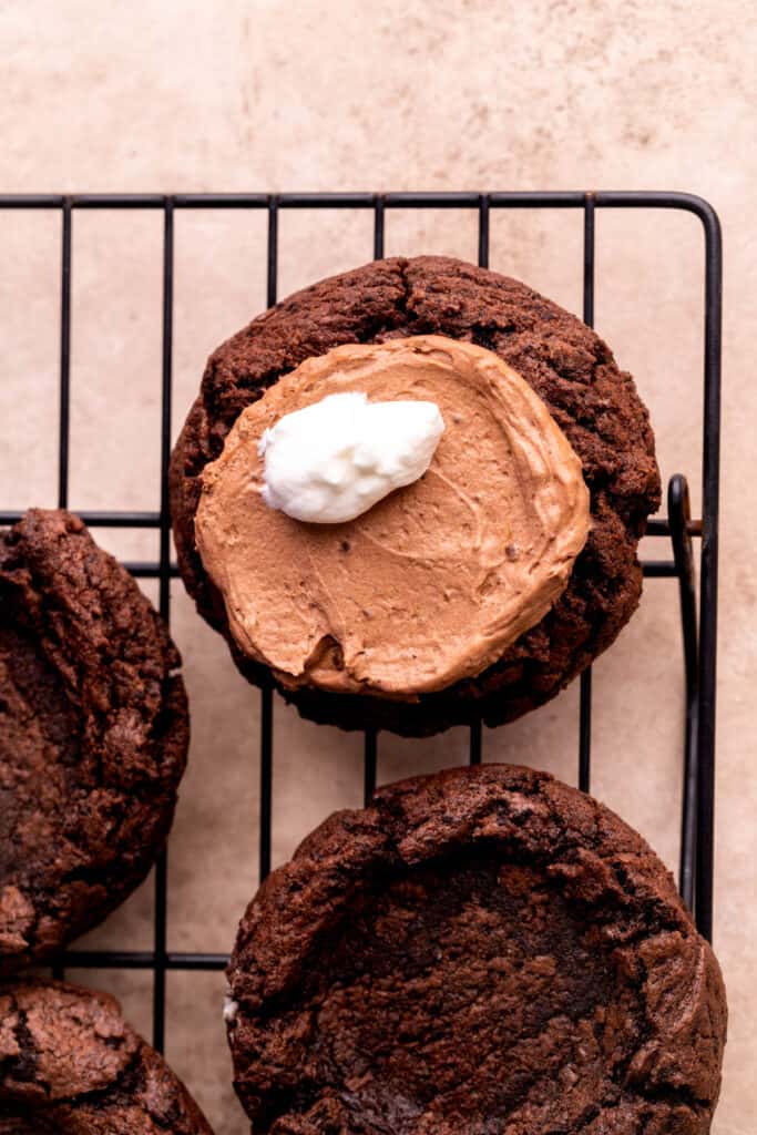 Whipped cream on top of cookie.
