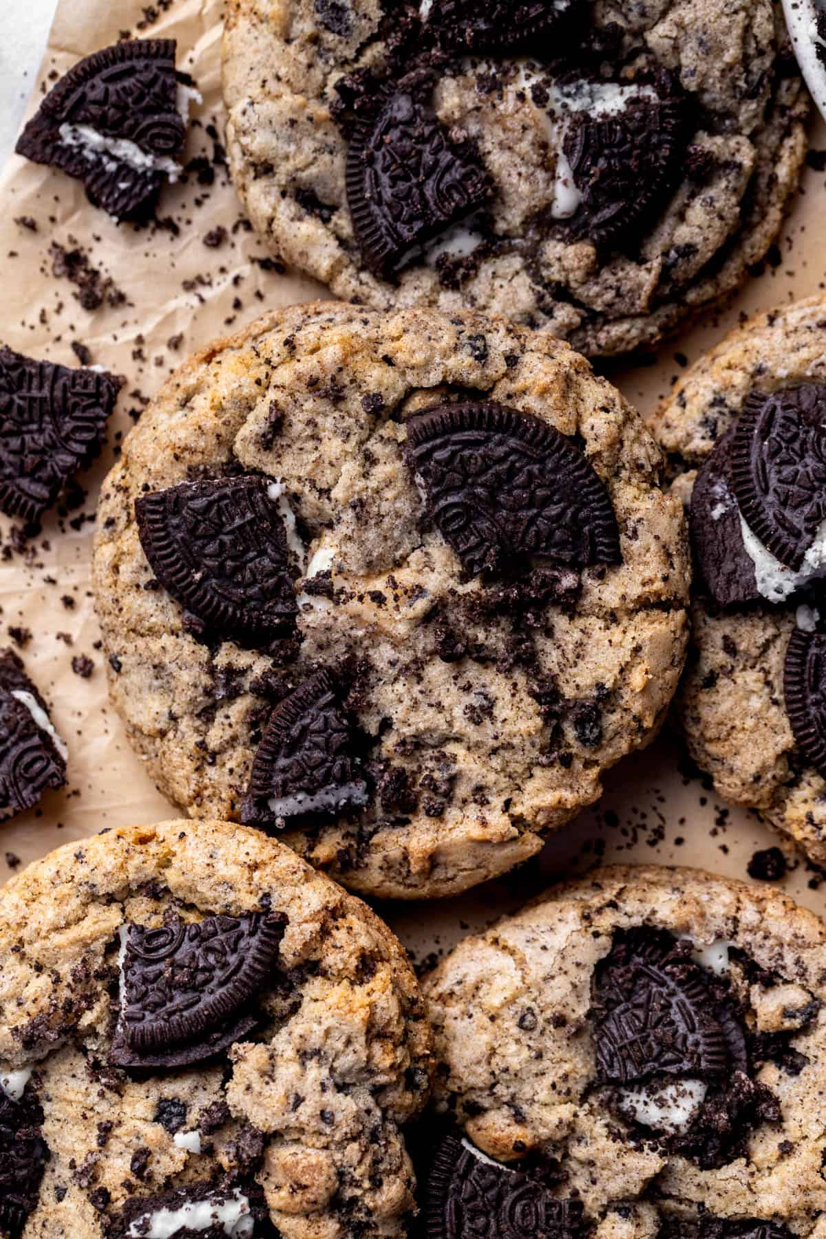 Oreo cheesecake cookies on parchment paper.