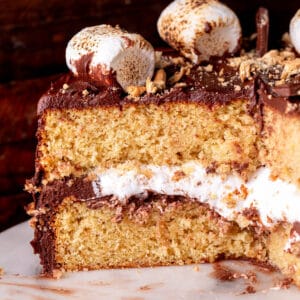 Decorated s'mores cake cut in half.