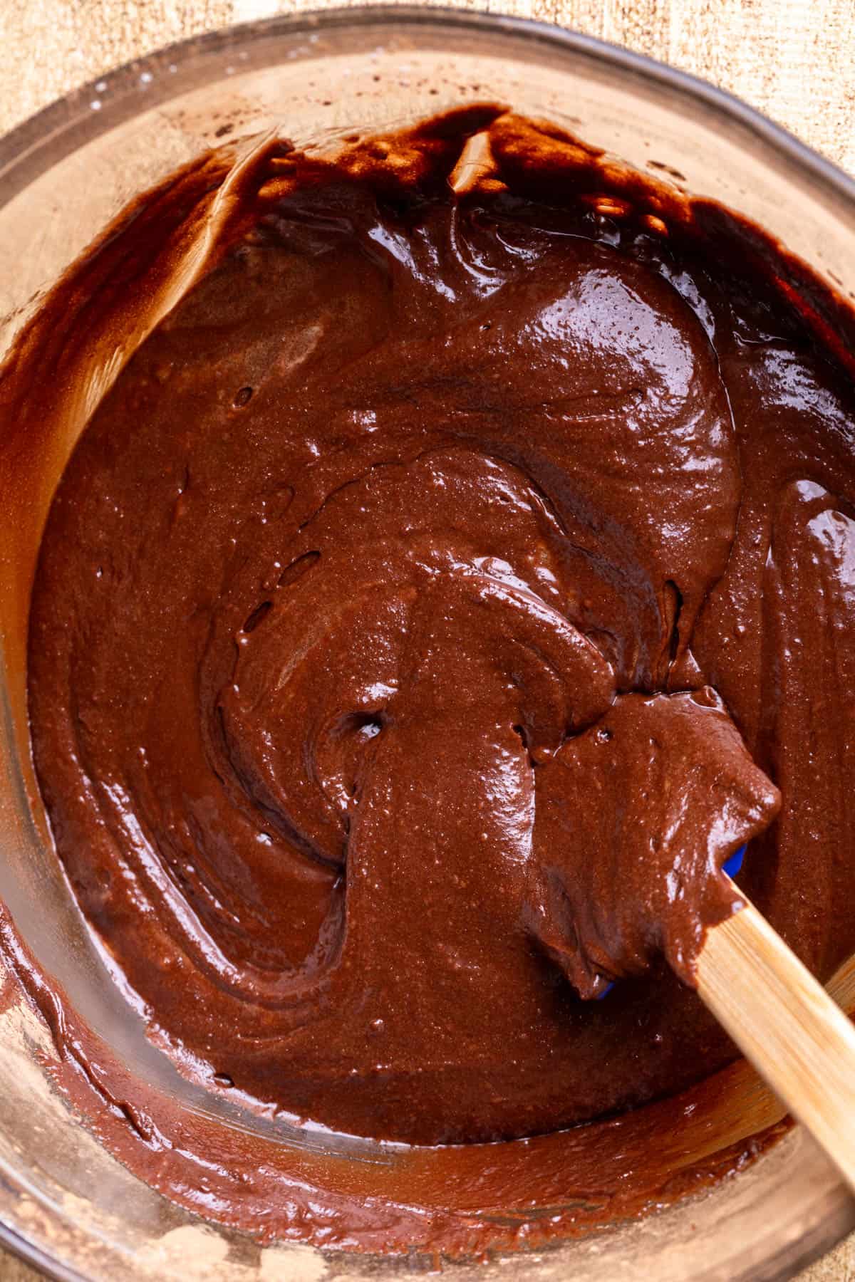Brownie batter in a glass bowl.