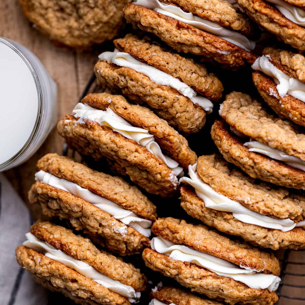 Oatmeal cream pies on its side on a wire rack.