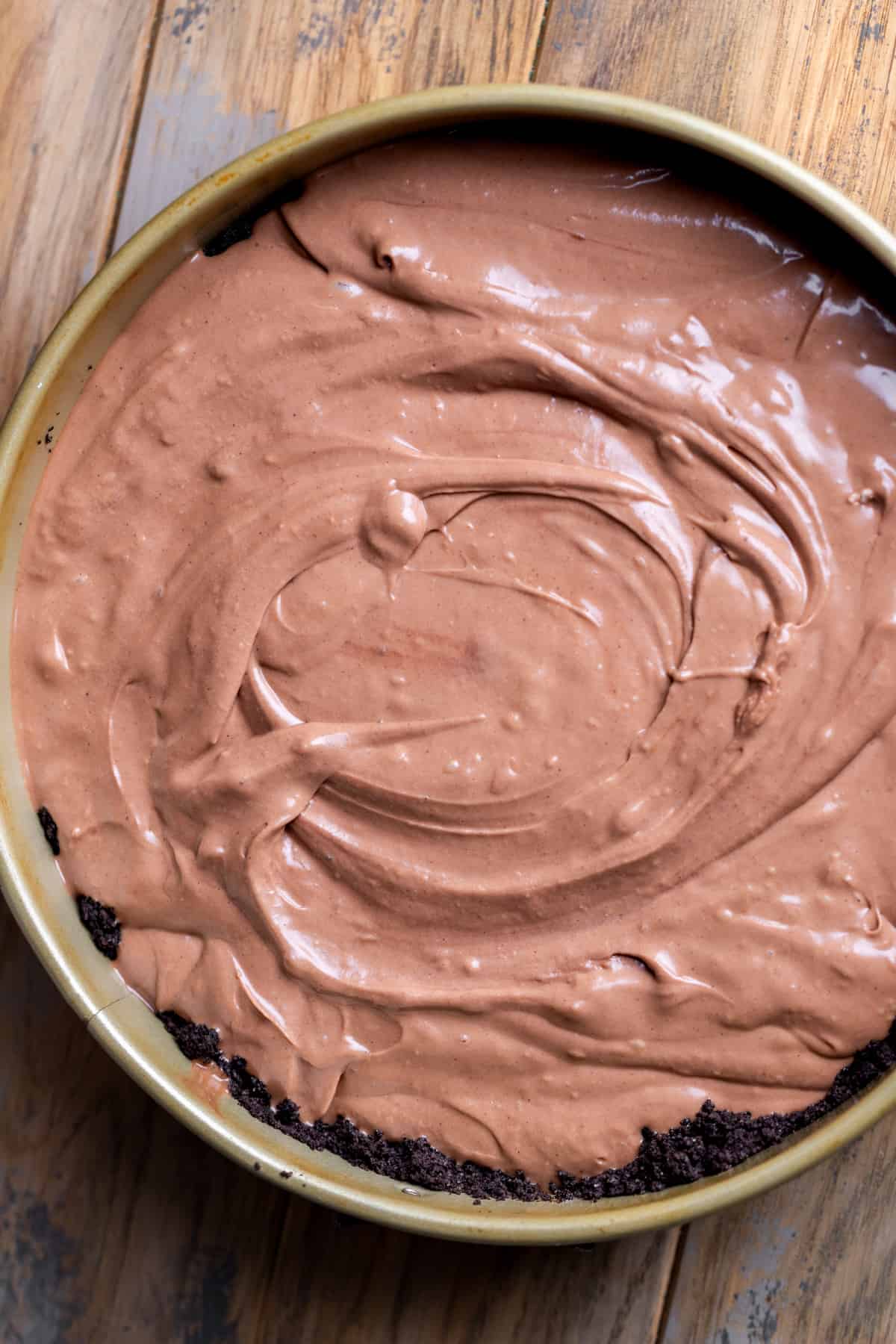 Nutella cheesecake batter in the pan.