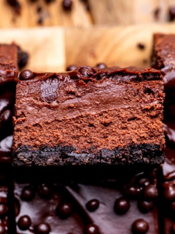 One chocolate cheesecake bar on it's side.