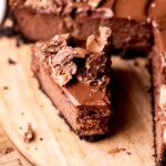 A bite missing from a slice of Nutella cheesecake.