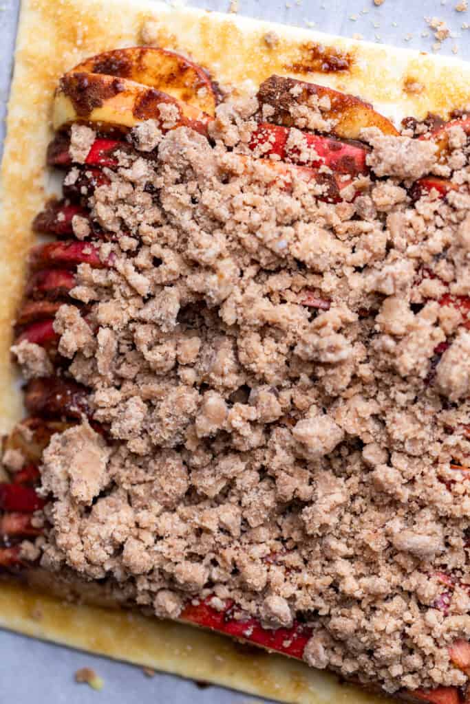 Streusel on top of apple puff pastry.