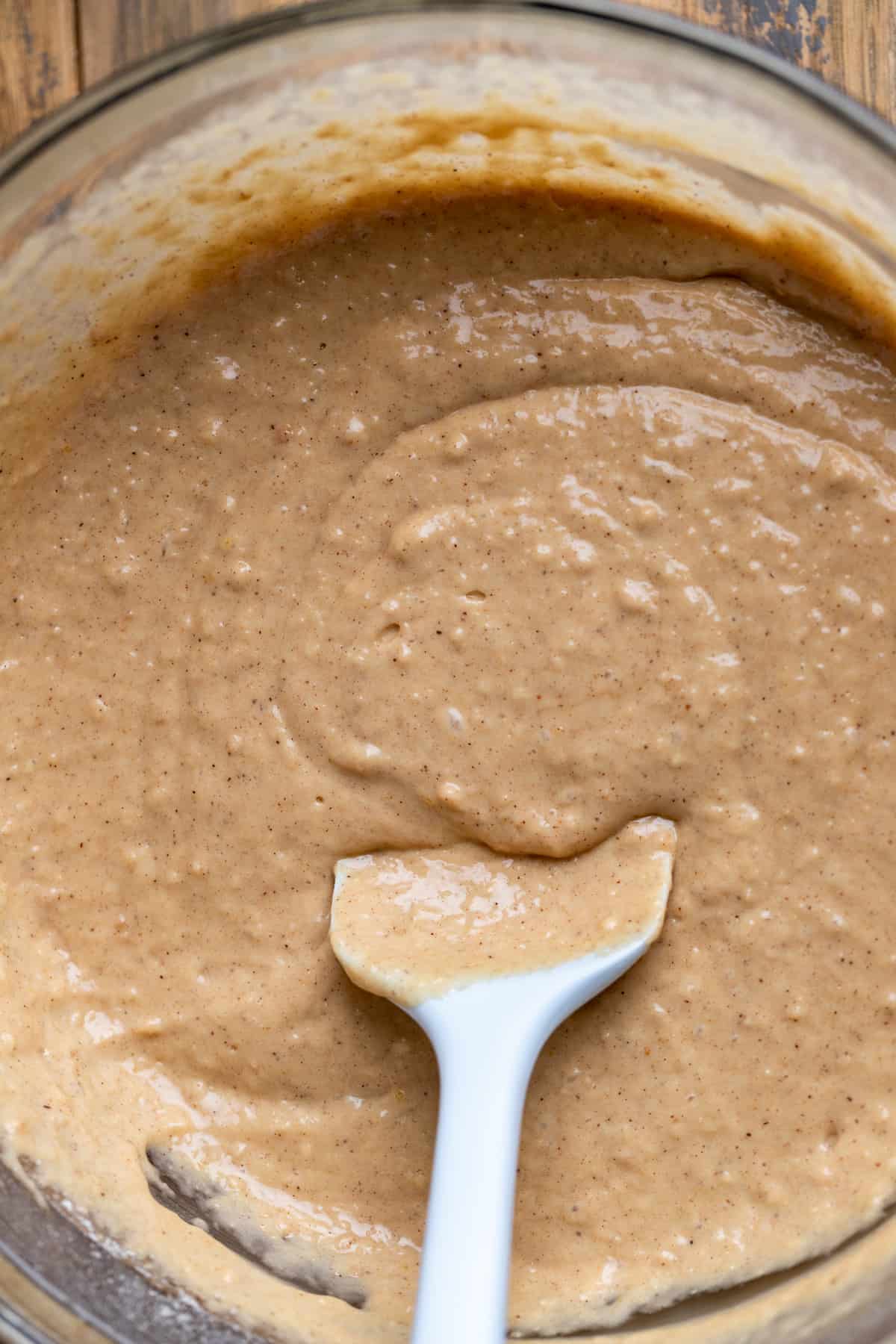 Muffin batter in a glass bowl.