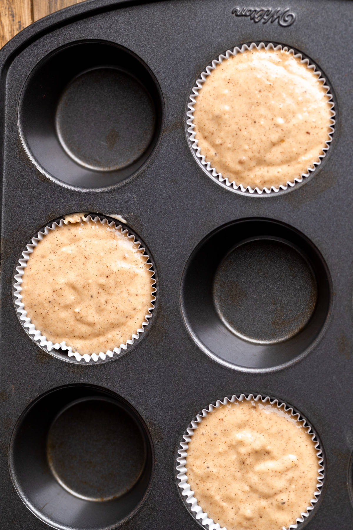 Muffin batter in a pan.