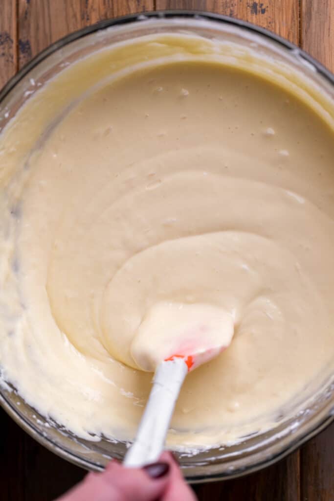 Cheesecake batter in a glass bowl.