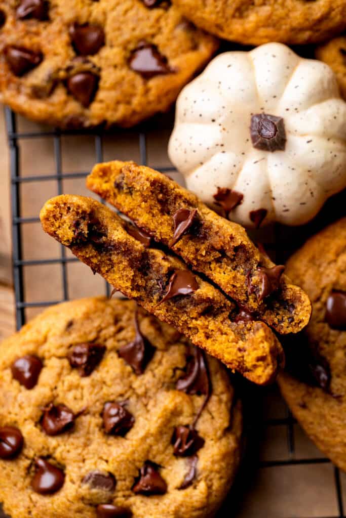 Pumpkin chocolate chip cookie split in half.