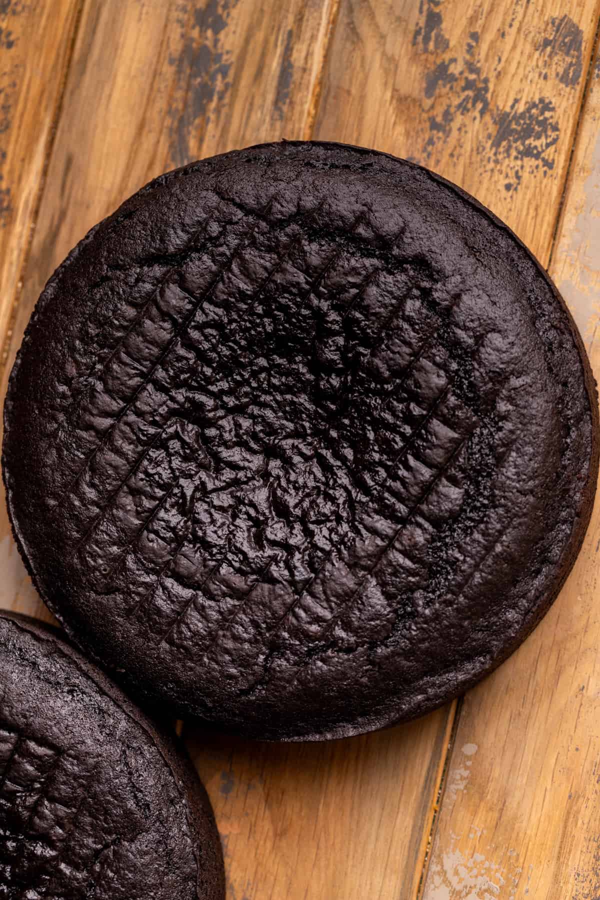Baked black cake layer.