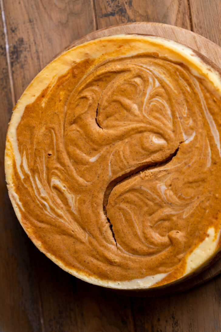 Baked cheesecake on a platter.