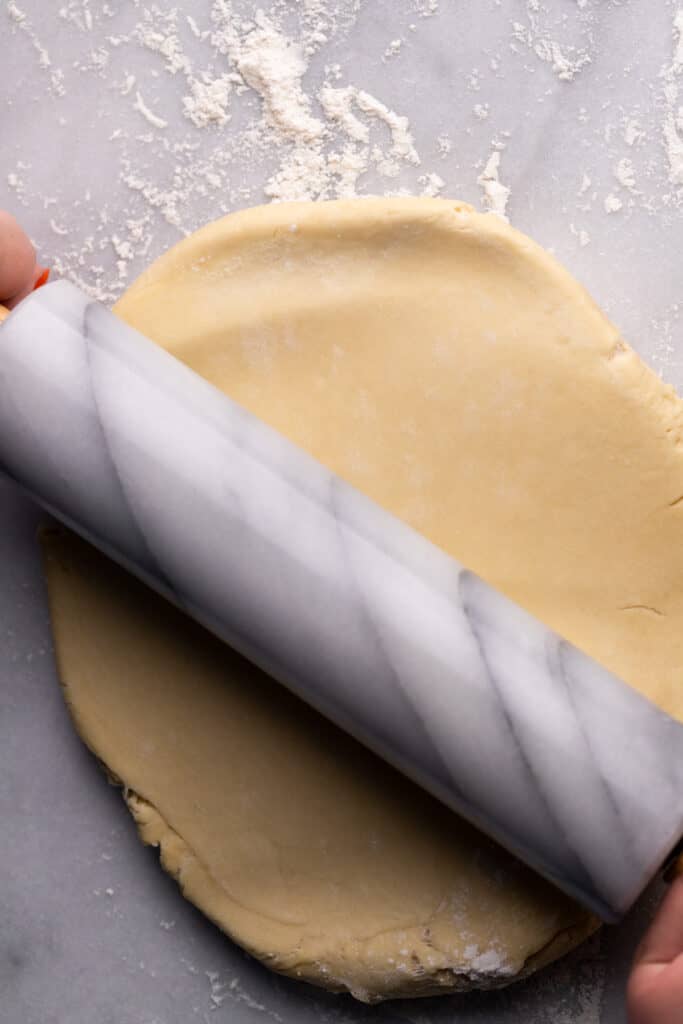 Rolling out the dough.