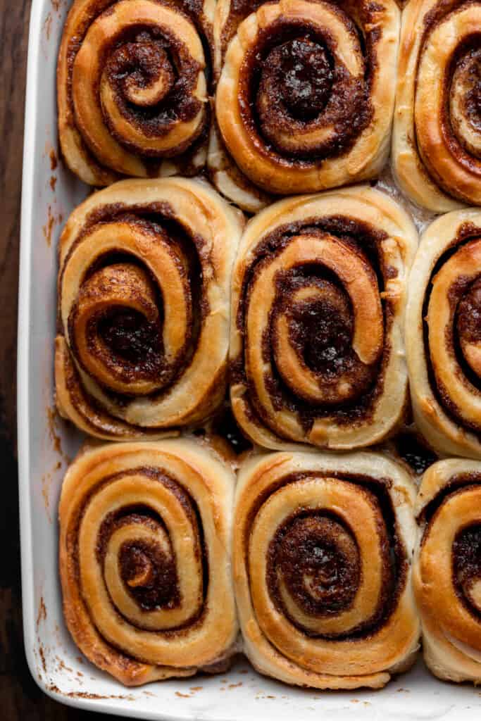 Baked cinnamon rolls in a pan.