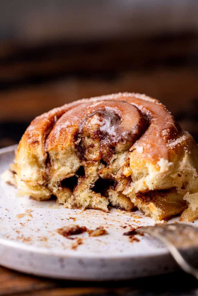 Bite missing from apple cider cinnamon rolls.