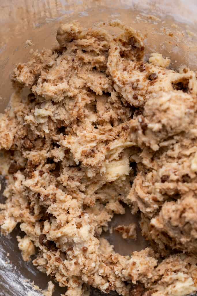 Cinnamon cookie dough in a glass bowl.