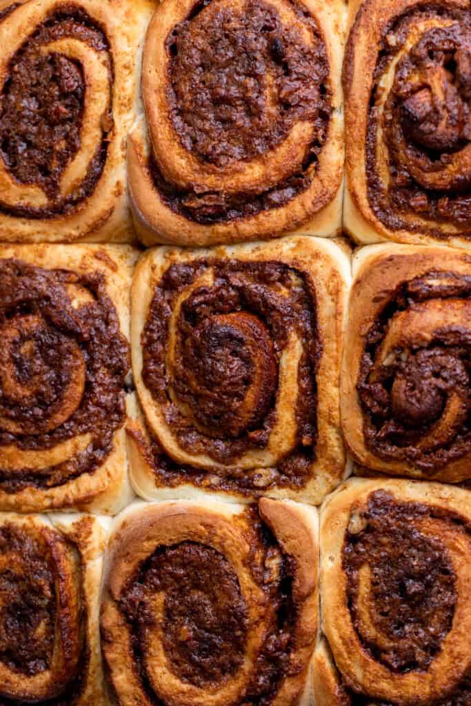 Baked cinnamon rolls in a pan.