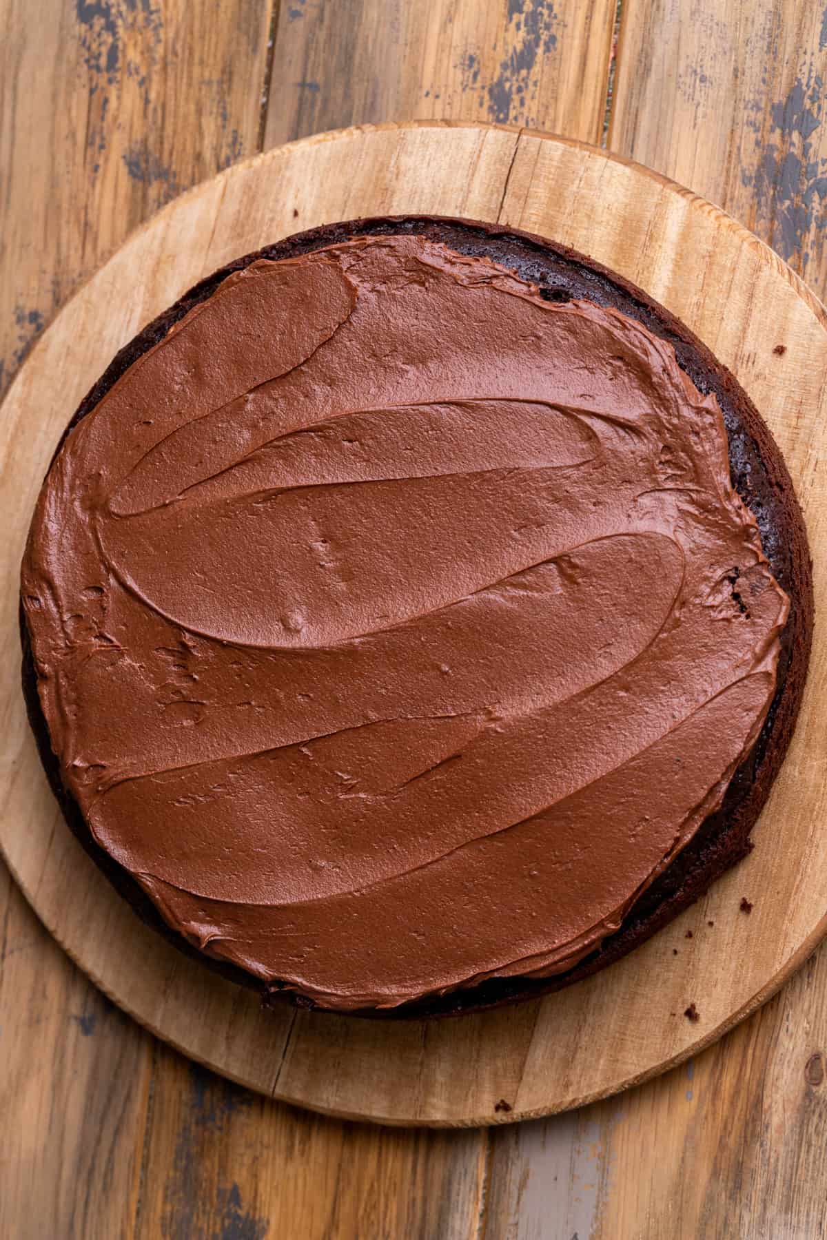 Chocolate frosting over the cake.