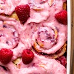 Lemon raspberry rolls with raspberry frosting on top.