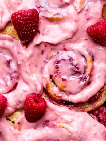 Lemon raspberry rolls with raspberry frosting on top.