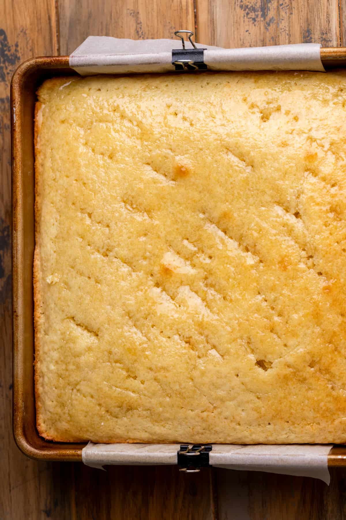Baked cake with the lemon syrup poked in.