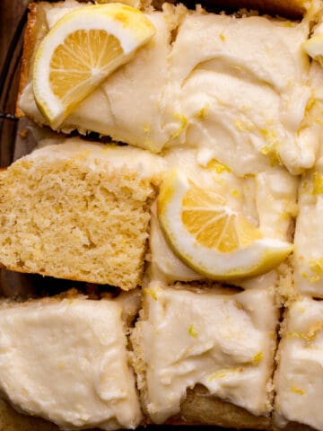 Lemon drizzle cake on a platter.