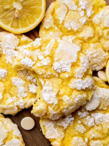 Top view of a bite missing from lemon crinkle cookies.