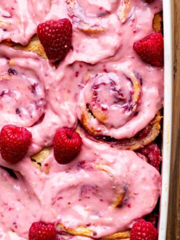 Lemon raspberry rolls with raspberry frosting on top.