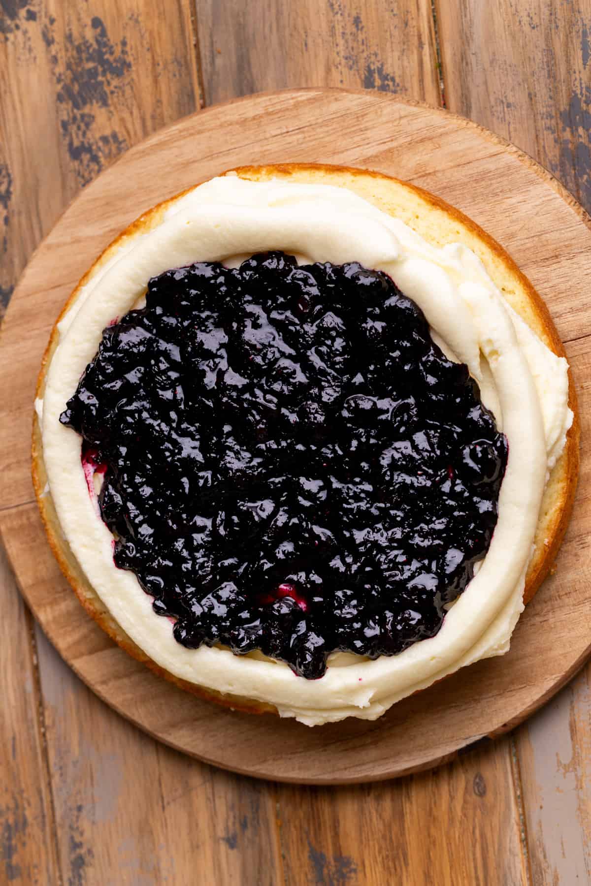 Blueberry jam over cake.