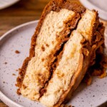 Slice of no bake biscoff cheesecake on a plate.