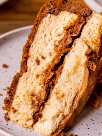 Slice of no bake biscoff cheesecake on a plate.