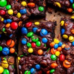M&M brownies on parchment paper.
