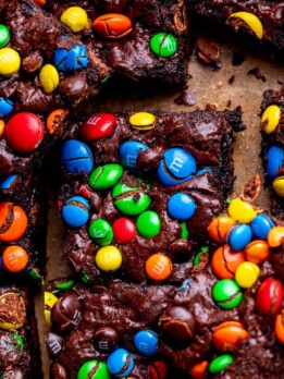 M&M brownies on parchment paper.