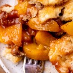 Cinnamon peach cobbler on a plate.