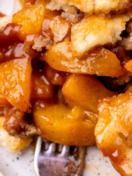 Cinnamon peach cobbler on a plate.