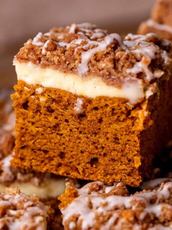 One slice of pumpkin coffee cake on top of others.