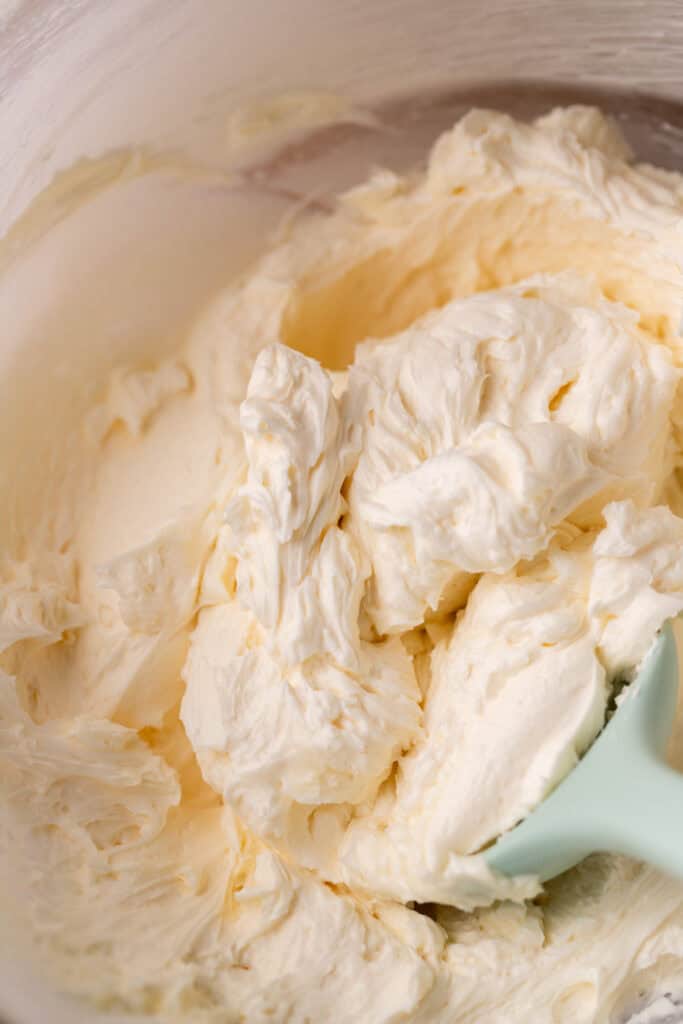 Marshmallow creme frosting in a glass bowl.