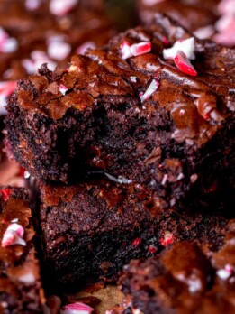 One stack of peppermint brownies with a bite missing.