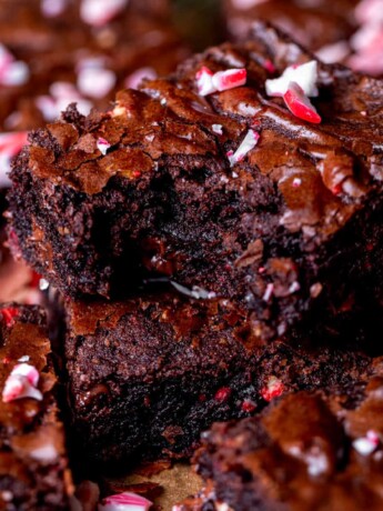 One stack of peppermint brownies with a bite missing.