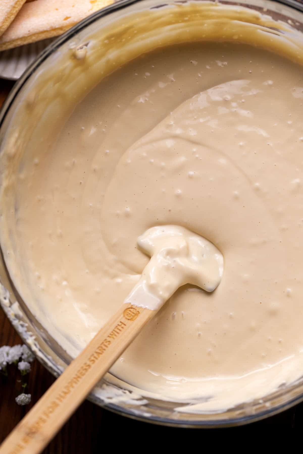Espresso cheesecake batter in a glass bowl.