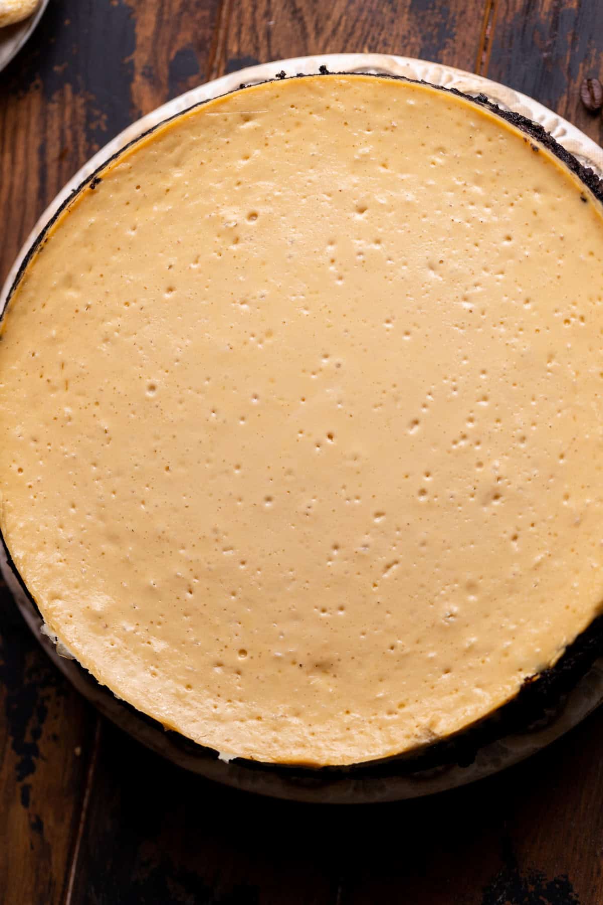 Baked cheesecake on a board.