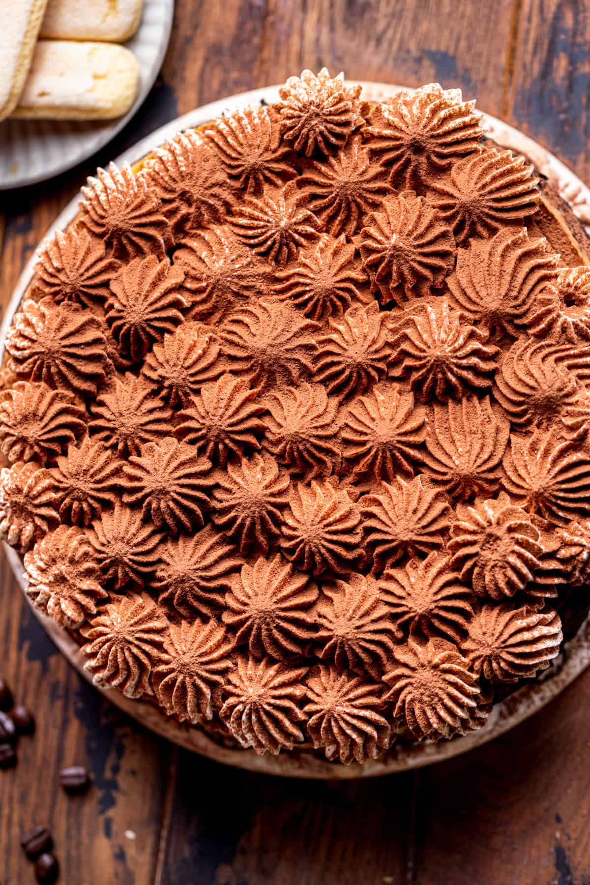 Decorated cheesecake on a board.