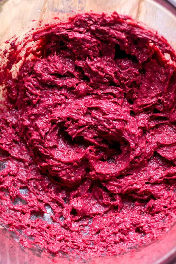 Raspberry pudding in glass bowl.