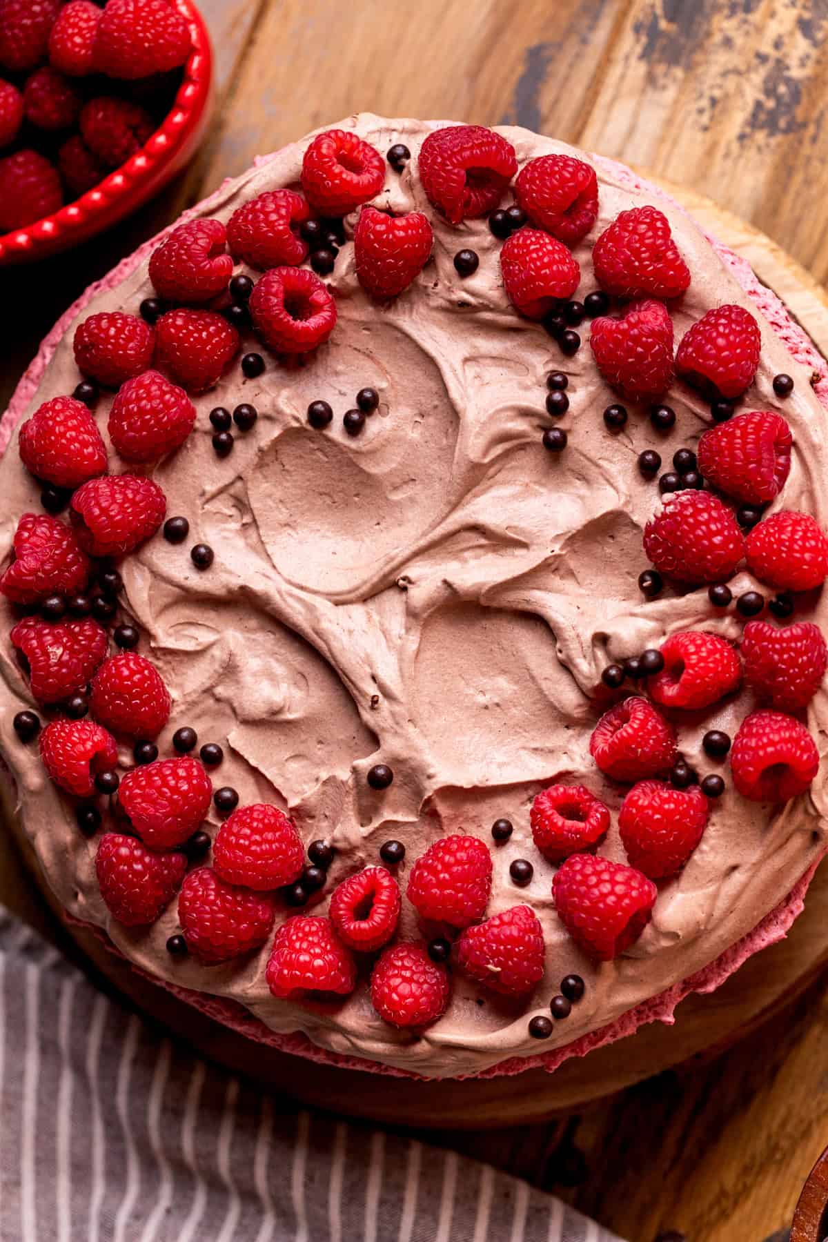 Decorated cake on wood board.