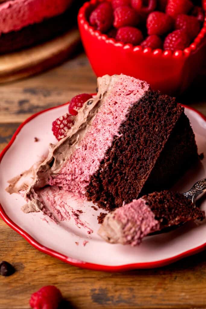 Bite missing from cake on the plate.