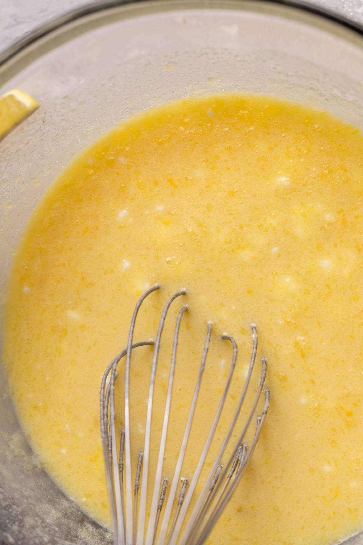 Wet ingredients in a glass bowl.